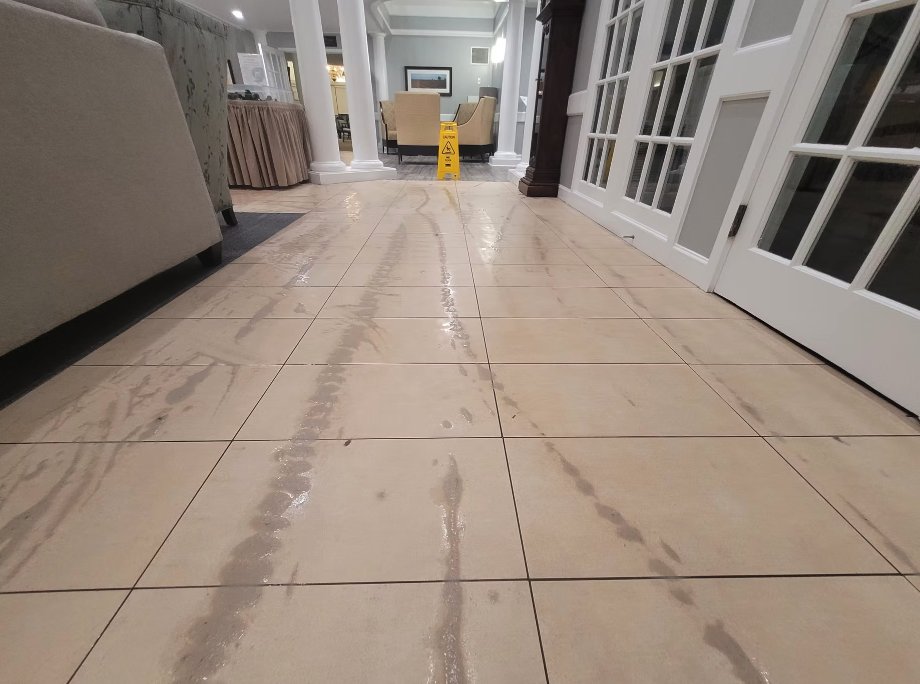 Commercial lobby tile floor during deep cleaning