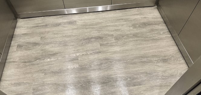 Commercial luxury vinyl plank floor after deep cleaning